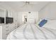 Spacious bedroom with calming white walls offers relaxation and comfort at 1728 Golfview Dr # 1728, Tarpon Springs, FL 34689