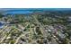 Aerial view displays home in neighborhood with waterfront views, lush greenery, and convenient city access at 210 83Rd N Ave, St Petersburg, FL 33702
