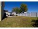 Large grassy backyard, perfect for outdoor activities, enclosed by a white vinyl fence at 210 83Rd N Ave, St Petersburg, FL 33702