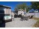 Paver patio with outdoor dining set, BBQ, and seating, ideal for entertaining at 210 83Rd N Ave, St Petersburg, FL 33702