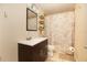 Bathroom with a vanity, mirror, lighting, and tiled shower with curtain at 210 83Rd N Ave, St Petersburg, FL 33702