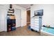 Bedroom with a dresser, a TV, and hardwood flooring at 210 83Rd N Ave, St Petersburg, FL 33702
