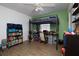 Bedroom with lofted bed, hardwood floors, and a ceiling fan at 210 83Rd N Ave, St Petersburg, FL 33702