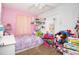 bedroom featuring playful pink accents, a window and hardwood-style flooring at 210 83Rd N Ave, St Petersburg, FL 33702