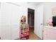 Bedroom offering a closet and shelf for added storage space at 210 83Rd N Ave, St Petersburg, FL 33702
