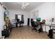 Bedroom featuring hardwood floors, a ceiling fan, and two workstations for added functionality at 210 83Rd N Ave, St Petersburg, FL 33702