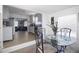 Cozy dining area with views into the living room and kitchen, creating an inviting atmosphere at 210 83Rd N Ave, St Petersburg, FL 33702