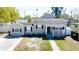 Charming single-story home with a welcoming front porch and well-maintained landscaping at 210 83Rd N Ave, St Petersburg, FL 33702