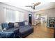 Spacious living area showcasing a large sectional and seamless transition to the kitchen at 210 83Rd N Ave, St Petersburg, FL 33702