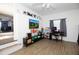 Living room with modern decor, hardwood floors, and a view to another room at 210 83Rd N Ave, St Petersburg, FL 33702