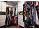 Spacious walk-in closet with custom built-in shelving, hanging rods, and plenty of storage space at 210 83Rd N Ave, St Petersburg, FL 33702