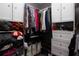 Spacious walk-in closet with custom built-in shelving, hanging rods, and plenty of storage space at 210 83Rd N Ave, St Petersburg, FL 33702