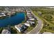 Panoramic aerial view of lakeside homes in a serene neighborhood with winding roads and mature trees at 3248 Anchor Bay Trl, Bradenton, FL 34211