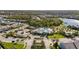 Scenic aerial view of the community pool and recreation areas, surrounded by lush greenery and waterways at 3248 Anchor Bay Trl, Bradenton, FL 34211