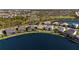 Aerial view of waterfront homes and landscaping, showcasing the lake and backyard views at 3248 Anchor Bay Trl, Bradenton, FL 34211