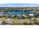 Stunning aerial view showcasing waterfront homes surrounding a picturesque lake in a well-maintained residential community at 3248 Anchor Bay Trl, Bradenton, FL 34211