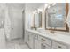 Elegant bathroom with double vanity, marble flooring, and gold hardware at 3248 Anchor Bay Trl, Bradenton, FL 34211