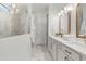 Elegant bathroom boasts dual sinks, gold accents, and a glass-enclosed marble shower at 3248 Anchor Bay Trl, Bradenton, FL 34211