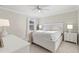 Cozy bedroom with a ceiling fan, soft lighting, and neutral decor, creating a serene retreat at 3248 Anchor Bay Trl, Bradenton, FL 34211