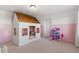 Playful ' bedroom features a dollhouse and a custom-built playhouse at 3248 Anchor Bay Trl, Bradenton, FL 34211