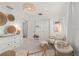 Bright Bedroom with white walls, woven decor, comfortable rocking chair, and a stylish dresser, creating a cozy atmosphere at 3248 Anchor Bay Trl, Bradenton, FL 34211