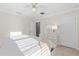 Bright bedroom featuring soft lighting, wood floors and neutral decor, creating a relaxing retreat at 3248 Anchor Bay Trl, Bradenton, FL 34211