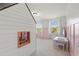 Playful bedroom featuring a built-in playhouse, pink accents, and ample natural light from the windows at 3248 Anchor Bay Trl, Bradenton, FL 34211