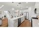 Spacious, modern kitchen featuring a large island, pendant lights, and stainless steel appliances, perfect for entertaining at 3248 Anchor Bay Trl, Bradenton, FL 34211