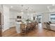 Modern kitchen featuring white cabinets, a large island, and stainless steel appliances at 3248 Anchor Bay Trl, Bradenton, FL 34211