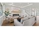 Inviting living room with a modern fireplace, comfortable seating, and elegant decor creating a cozy atmosphere at 3248 Anchor Bay Trl, Bradenton, FL 34211