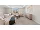 Spacious living room with tray ceilings, a large sectional sofa, and neutral decor at 3248 Anchor Bay Trl, Bradenton, FL 34211