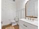 Stylish powder room featuring designer wallpaper, white wainscoting, and modern fixtures at 3248 Anchor Bay Trl, Bradenton, FL 34211