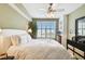Light-filled bedroom boasts wooden floors and plantation shutters offering both style and privacy at 345 Bayshore Blvd # P9, Tampa, FL 33606