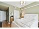 Bright bedroom featuring a ceiling fan, wooden floors, a lamp, and nautical-themed decor at 345 Bayshore Blvd # P9, Tampa, FL 33606