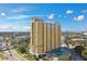 A stunning view of the yellow and white high-rise building under a clear blue sky at 345 Bayshore Blvd # P9, Tampa, FL 33606