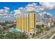 A stunning view of the yellow and white high-rise building under a clear blue sky at 345 Bayshore Blvd # P9, Tampa, FL 33606