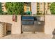 Outdoor grill area features a stainless steel grill, stone surround, and outdoor cooking space at 345 Bayshore Blvd # P9, Tampa, FL 33606