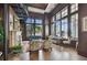 Elegant living room with a fireplace, spiral staircase, and large windows offering city views at 345 Bayshore Blvd # P9, Tampa, FL 33606
