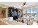Cozy living room with a view of the balcony and a large bookcase at 345 Bayshore Blvd # P9, Tampa, FL 33606