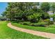 Landscaped community pet walk with stone path and tropical plants at 345 Bayshore Blvd # P9, Tampa, FL 33606