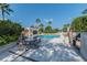Community pool area with lush landscaping, seating, an outdoor grill, and a relaxing atmosphere at 345 Bayshore Blvd # P9, Tampa, FL 33606