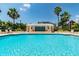 Beautiful outdoor swimming pool surrounded by lush tropical landscaping and sunny sky at 345 Bayshore Blvd # P9, Tampa, FL 33606