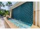 Beautiful community pool area with a decorative tiled water feature and lounge chairs for relaxing at 345 Bayshore Blvd # P9, Tampa, FL 33606