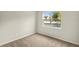 Bedroom with plush carpeting, neutral walls and a window offering natural light and outdoor views at 3460 Timber Crossing Ave, Brandon, FL 33511