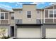 Modern townhouse featuring a two-car garage and neutral-toned exterior at 3460 Timber Crossing Ave, Brandon, FL 33511