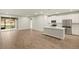 Spacious living area featuring tile floors and kitchen with quartz countertops at 3460 Timber Crossing Ave, Brandon, FL 33511