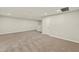 Large, bright living area with neutral carpet, recessed lighting, and open layout at 3460 Timber Crossing Ave, Brandon, FL 33511