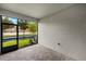Enclosed patio with brick flooring offering relaxing views of the water at 3460 Timber Crossing Ave, Brandon, FL 33511
