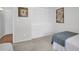 Cozy bedroom featuring carpet, wall art, and a double door closet for optimal storage solutions at 3479 Maclaren Dr, Palm Harbor, FL 34684