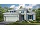 Charming single-Gathering home with a two-car garage, landscaped yard, and modern architectural details at 3559 Santa Caterina Blvd, Bradenton, FL 34211
